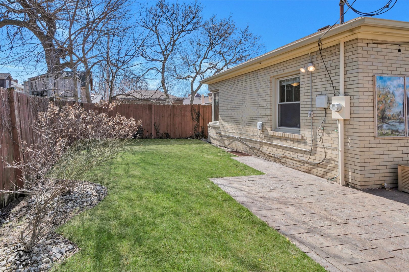 10025 South Hamilton Avenue Chicago, IL 60643 - Photo 47 of 51 a backyard of a house with large trees and wooden fence
