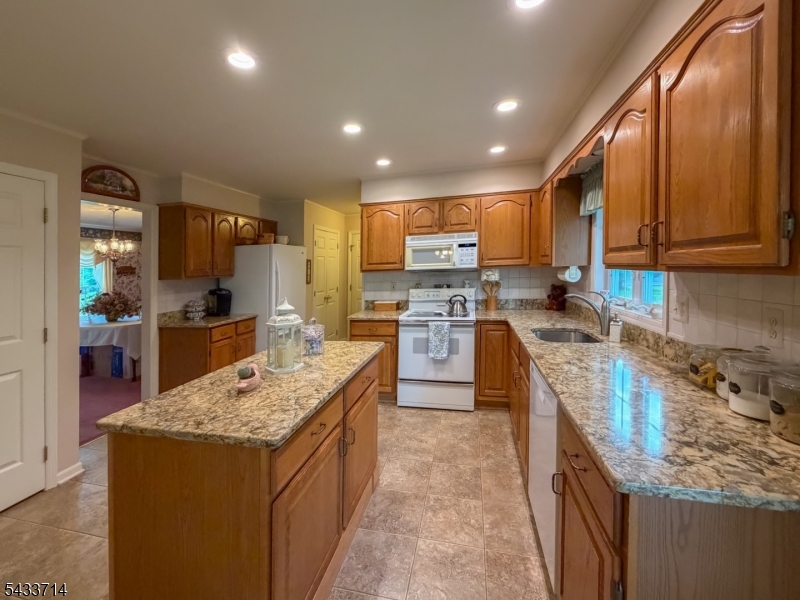29 Lark Lane Oak Ridge, NJ 07438 - Photo 4 of 26 a large kitchen with stainless steel appliances granite countertop a stove sink and cabinets