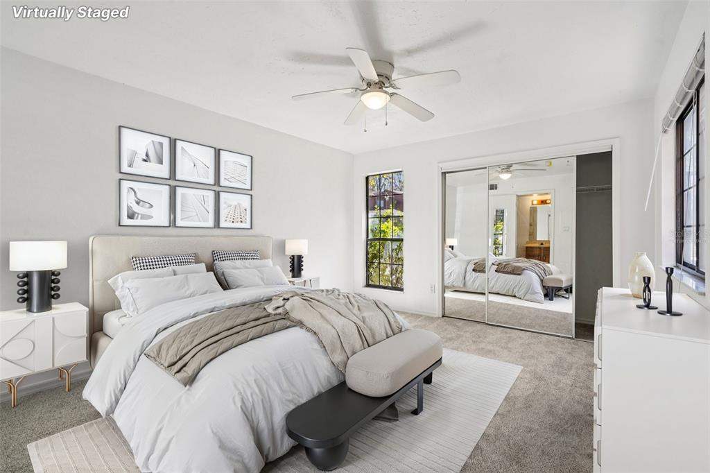 5606 Southwest 8th Place Gainesville, FL 32607 - Photo 13 of 28 a bedroom with a large bed and a couch