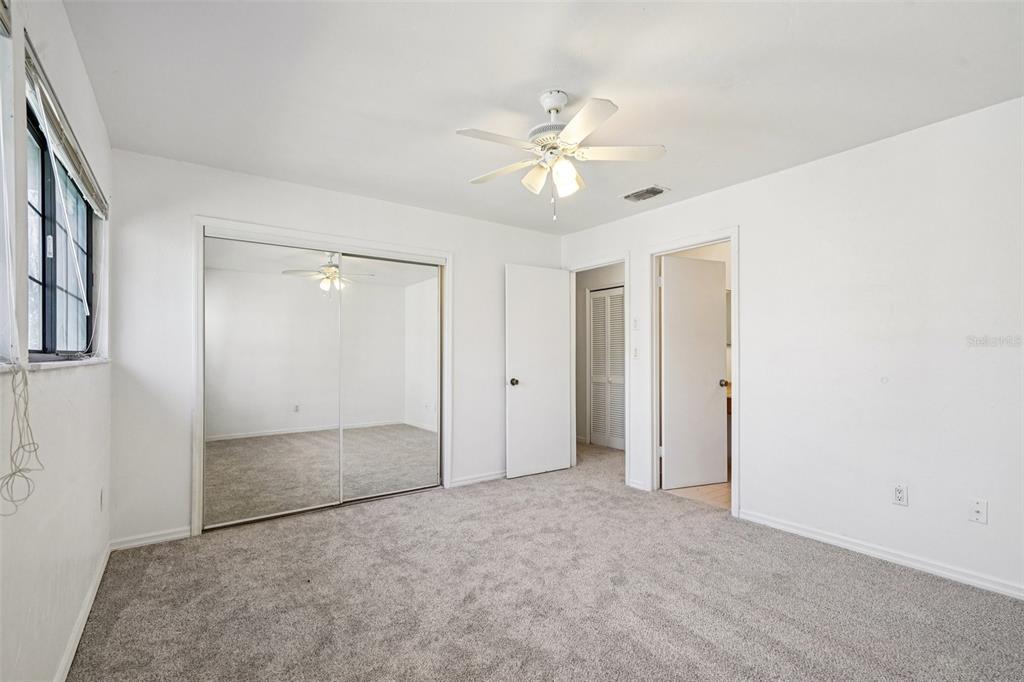 5606 Southwest 8th Place Gainesville, FL 32607 - Photo 18 of 28 a view of an empty room with a fan