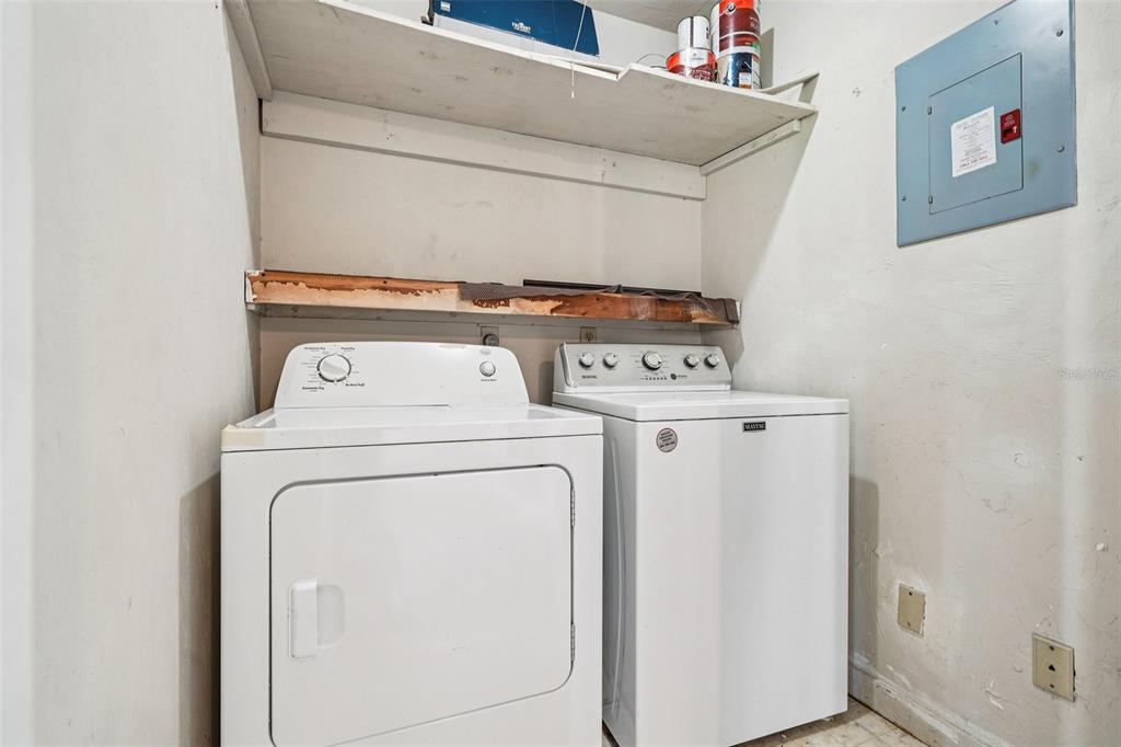 5606 Southwest 8th Place Gainesville, FL 32607 - Photo 23 of 28 a utility room with dryer and washer