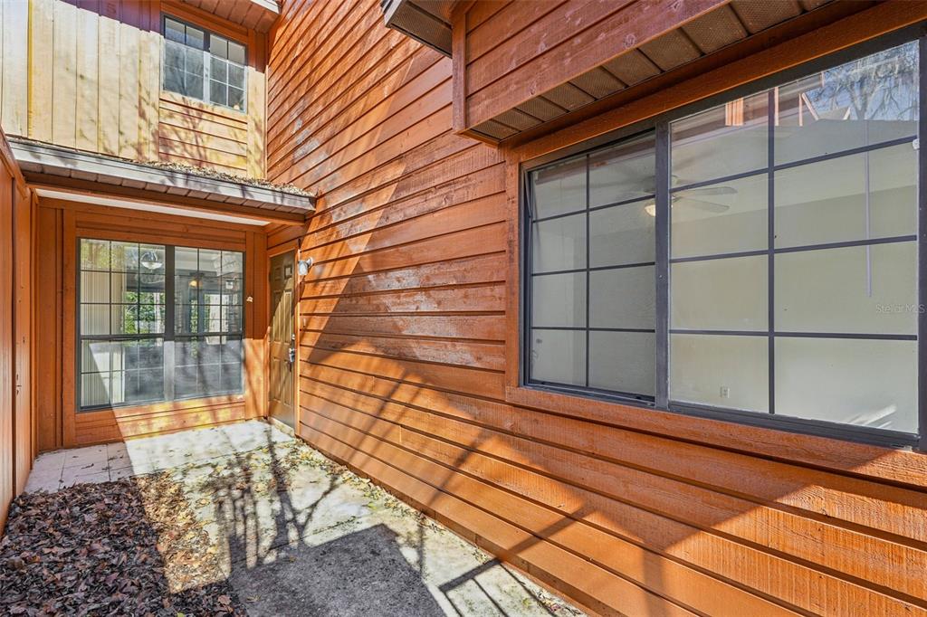 5606 Southwest 8th Place Gainesville, FL 32607 - Photo 3 of 28 a view of a door and a window