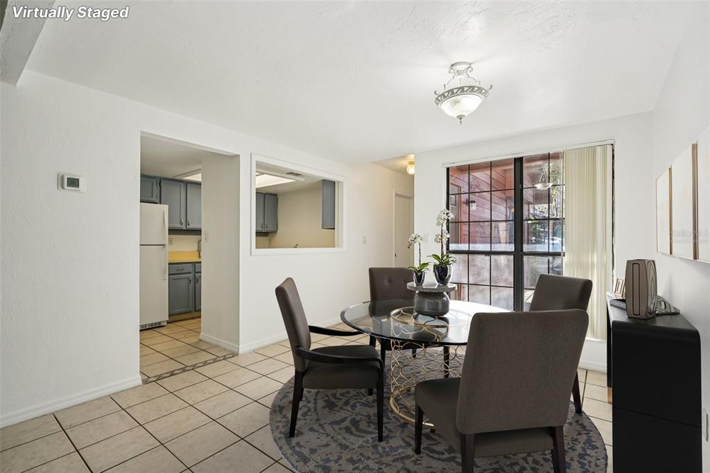 5606 Southwest 8th Place Gainesville, FL 32607 - Photo 5 of 28 a view of a dining room with furniture and a window