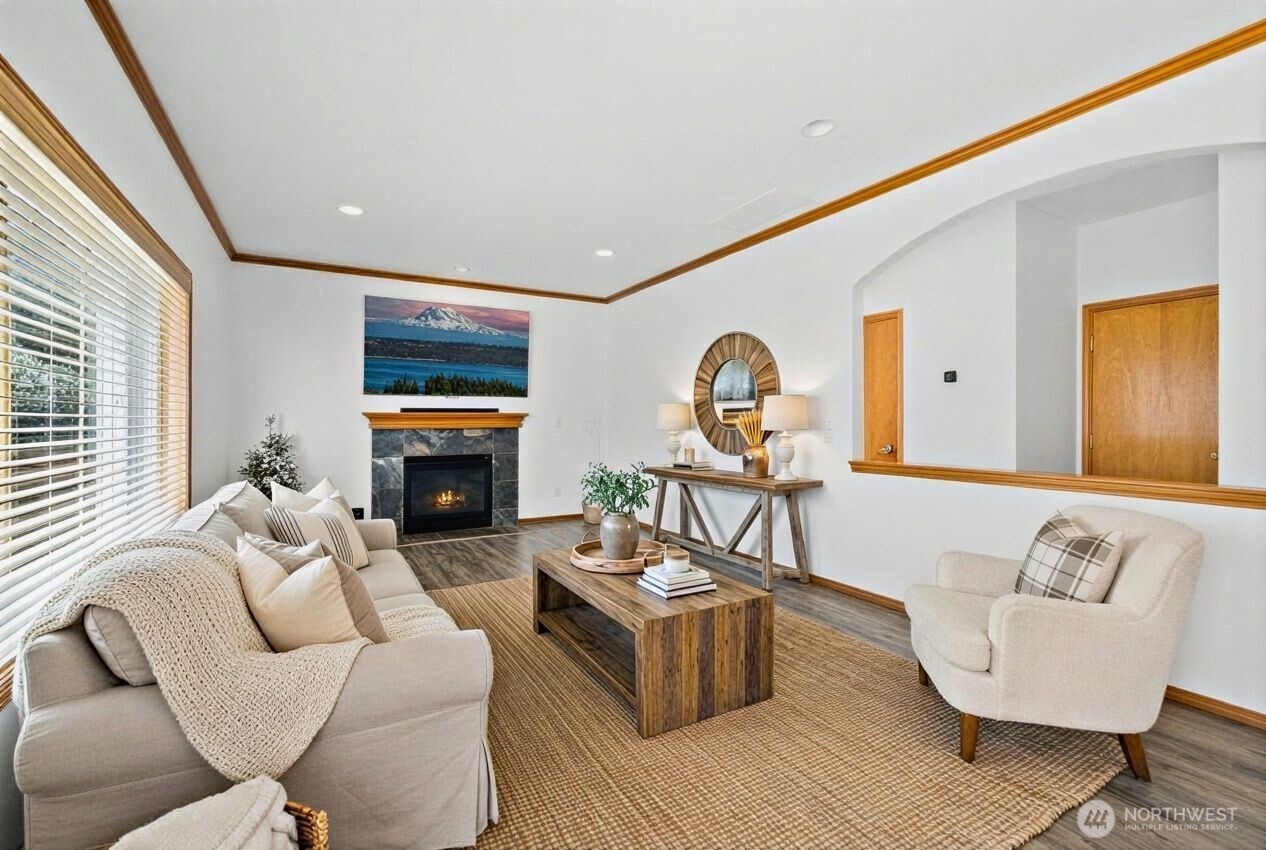 1496 Aberdeen Avenue Northeast Renton, WA 98056 - Photo 12 of 28 a living room with furniture a fireplace and a large window
