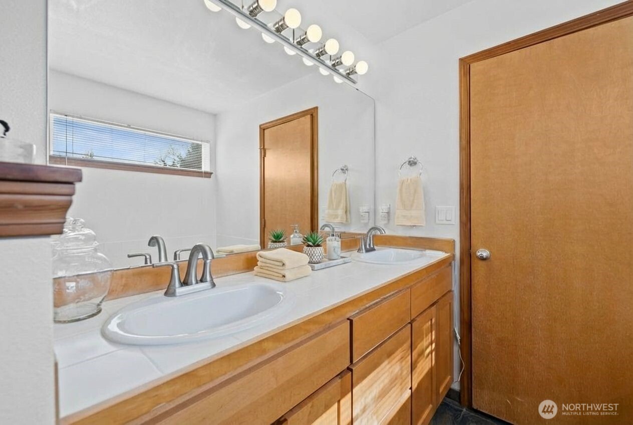 1496 Aberdeen Avenue Northeast Renton, WA 98056 - Photo 19 of 28 a bathroom with a sink and a mirror