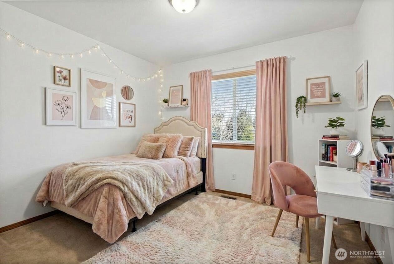 1496 Aberdeen Avenue Northeast Renton, WA 98056 - Photo 22 of 28 a bedroom with a bed and a large window