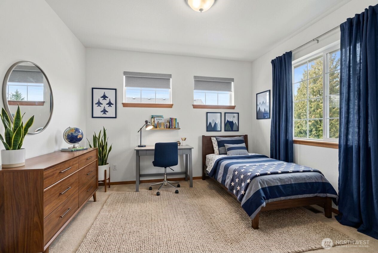 1496 Aberdeen Avenue Northeast Renton, WA 98056 - Photo 23 of 28 a bedroom with a bed and a windows