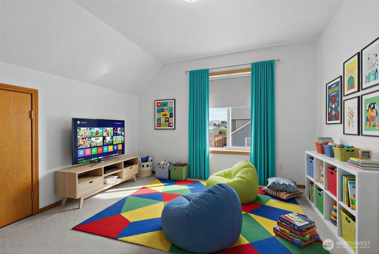 1496 Aberdeen Avenue Northeast Renton, WA 98056 - Photo 24 of 28 a bedroom with bed and a flat screen tv