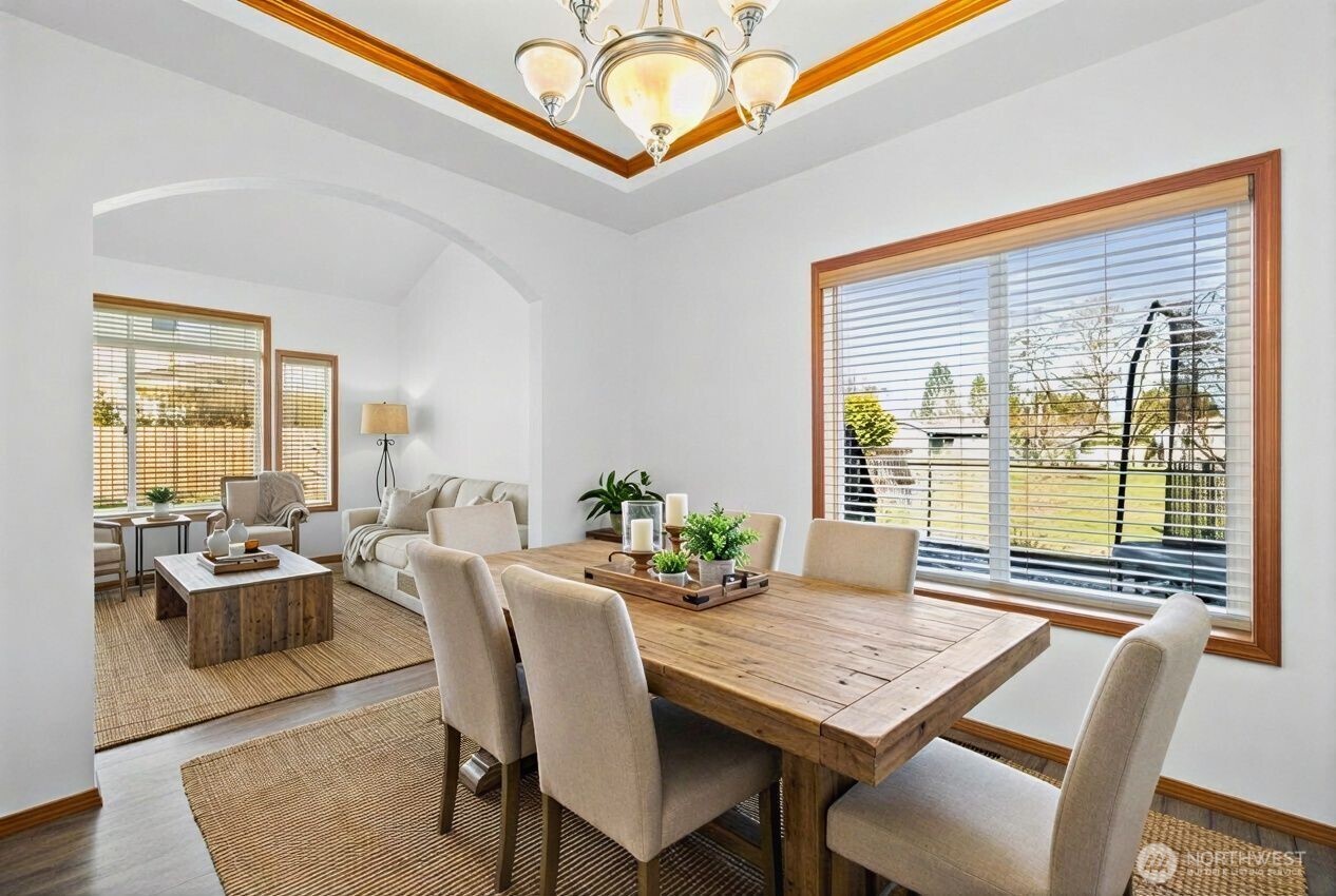 1496 Aberdeen Avenue Northeast Renton, WA 98056 - Photo 6 of 28 a view of a dining room with furniture window and wooden floor