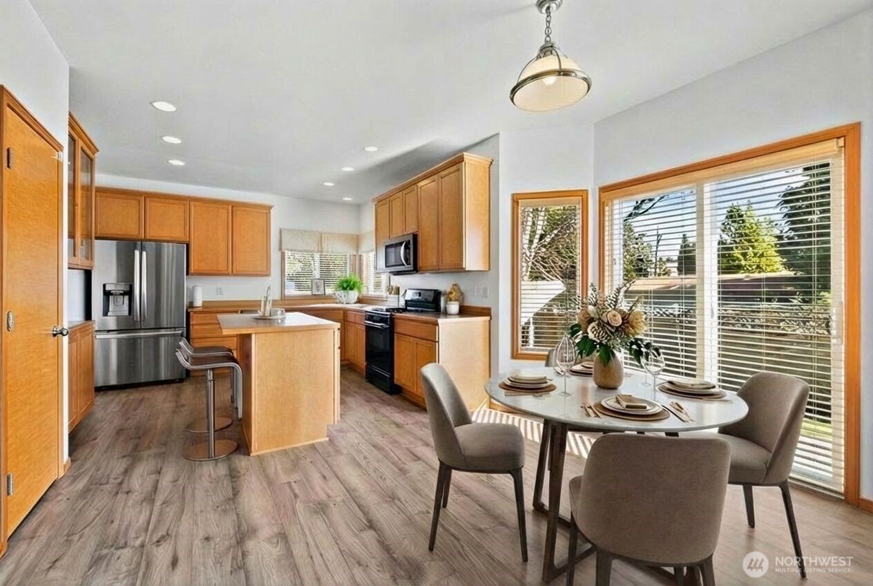 1496 Aberdeen Avenue Northeast Renton, WA 98056 - Photo 10 of 28 a view of a dining room with furniture window and outside view