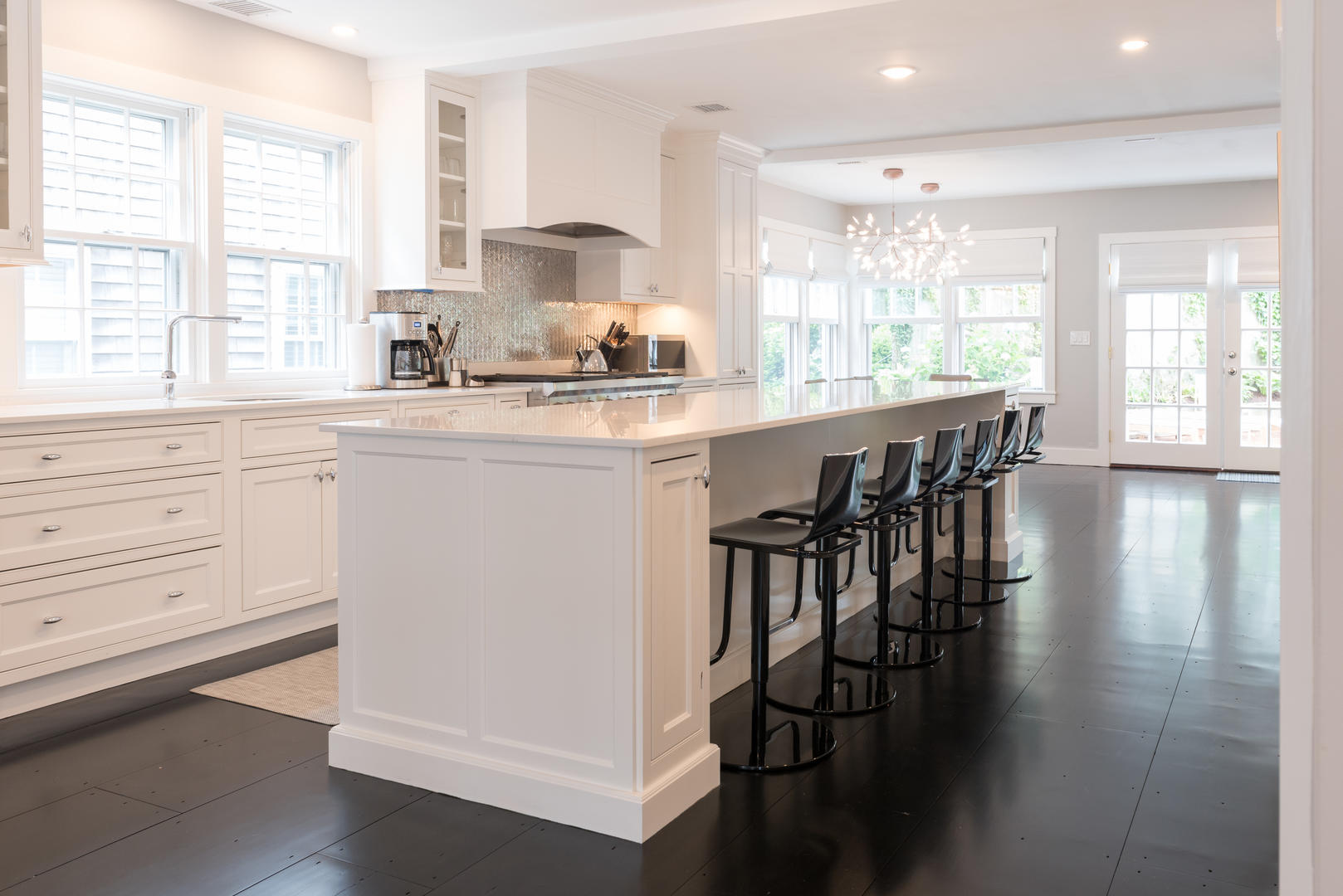 59 Orange Street Nantucket, MA 02554 - Photo 8 of 42 a kitchen with granite countertop white cabinets and appliances