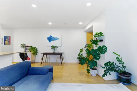 a living room with furniture flowerpot and flower pot