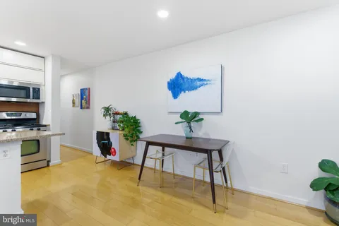 a workspace with furniture and a potted plant