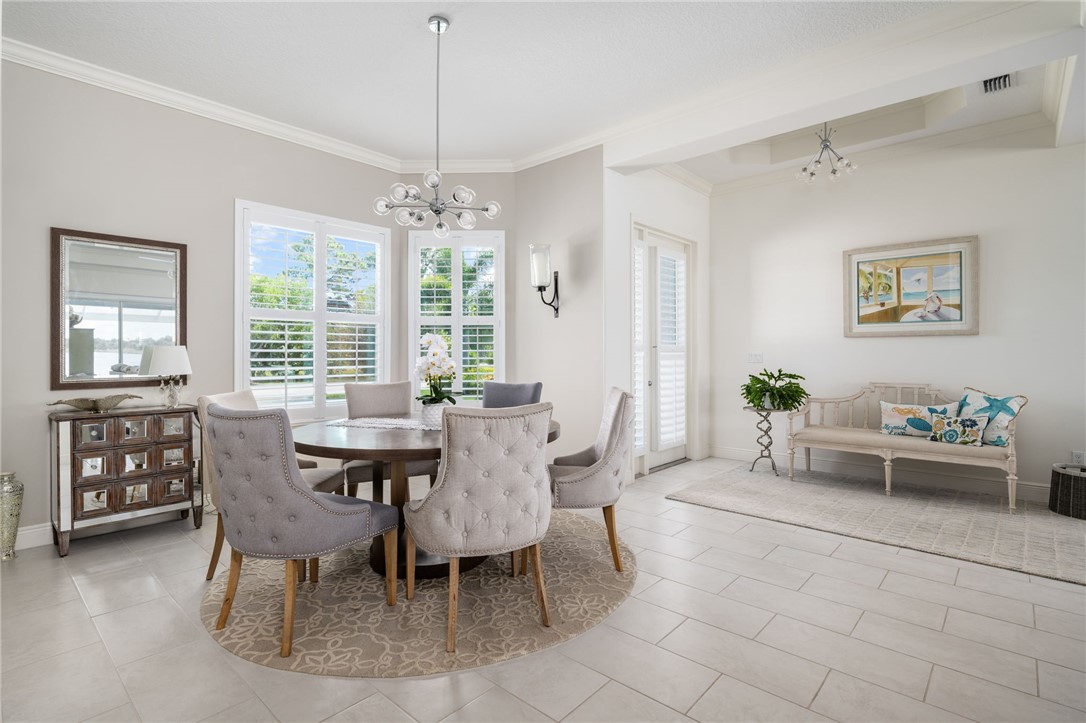 933 Yearling Trail Sebastian, FL 32958 - Photo 15 of 36 a view of a dining room with furniture window and outside view