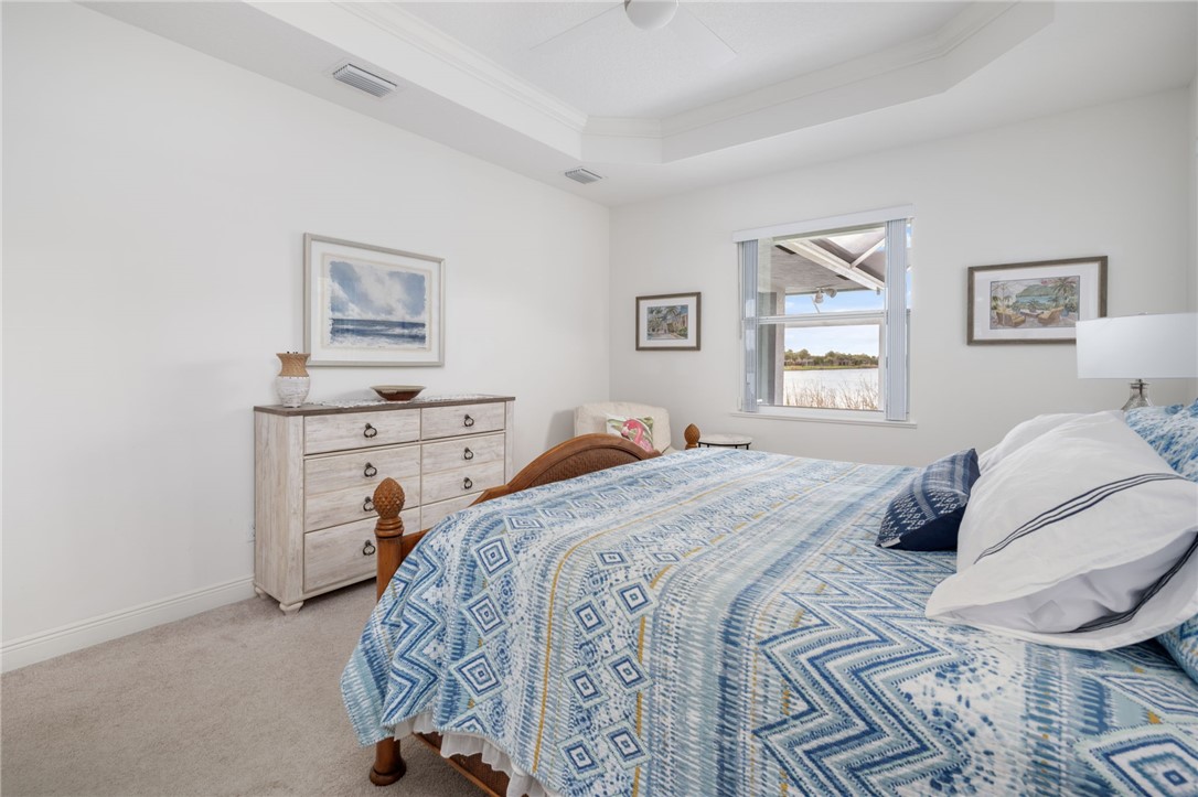 933 Yearling Trail Sebastian, FL 32958 - Photo 24 of 36 a bedroom with a bed and a window