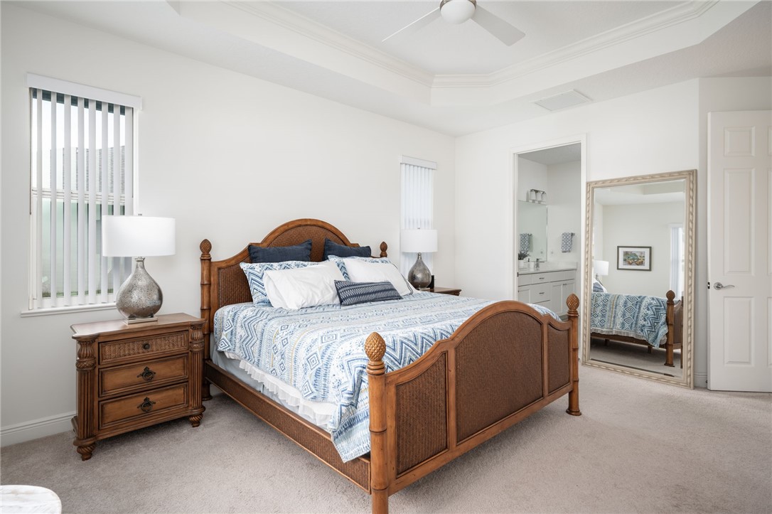 933 Yearling Trail Sebastian, FL 32958 - Photo 25 of 36 a bedroom with bed and window