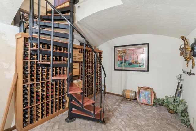 a view of a dining room with furniture and chandelier