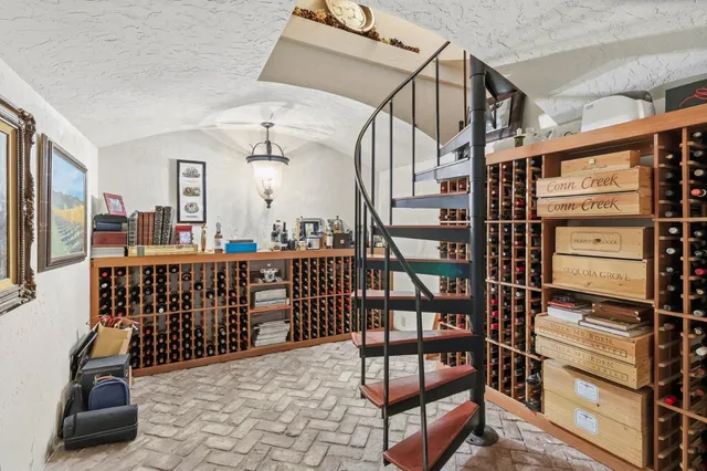 a view of a livingroom with furniture and floor to ceiling window