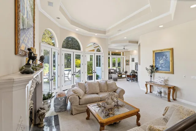 a kitchen with granite countertop a table chairs a sink dishwasher stove and cabinets with wooden floor