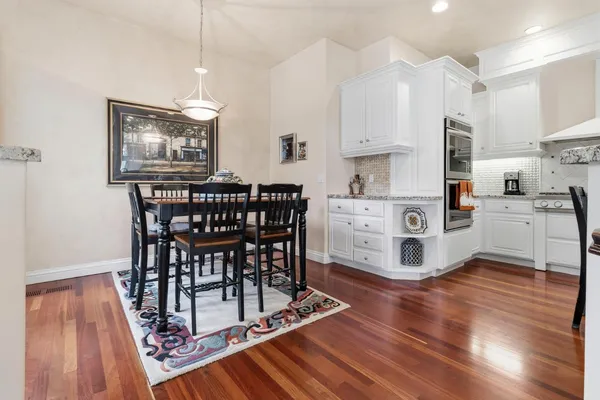 a bedroom with a large bed and a large window