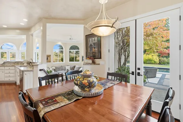 a view of a glass door with a yard from a window