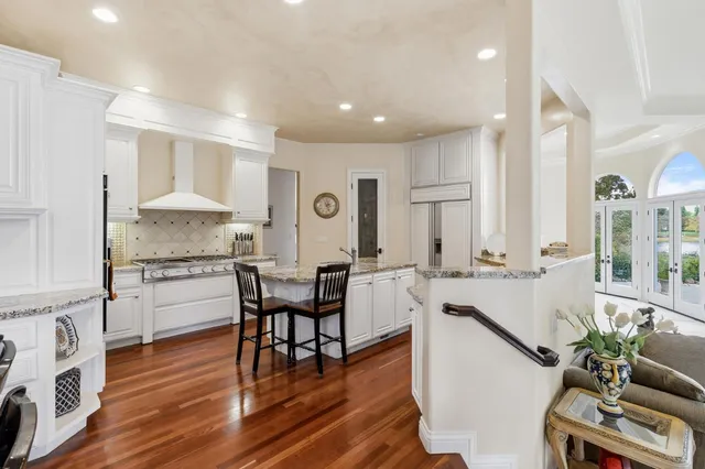 a view of a swimming pool with a yard