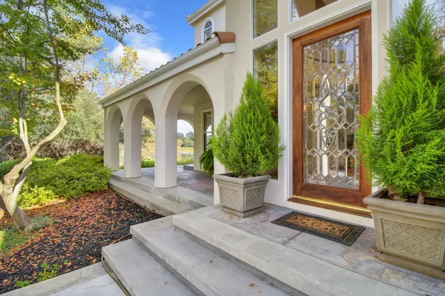 a view of an entryway with wooden floor