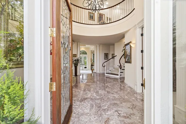 a view of a livingroom with furniture and chandelier
