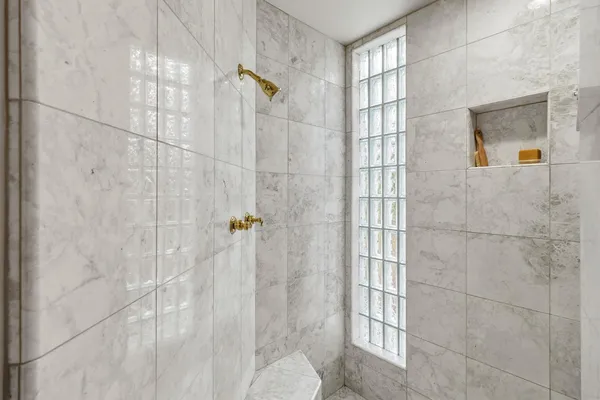 a view of a swimming pool with a yard and sitting area