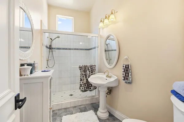 a view of a patio with a table and chairs under an umbrella
