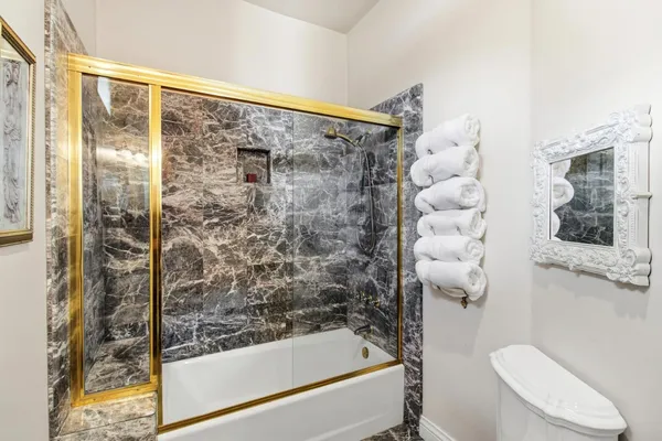 a view of a yard with plants and trees