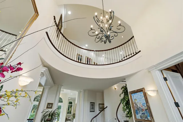 a front view of a house with a fountain