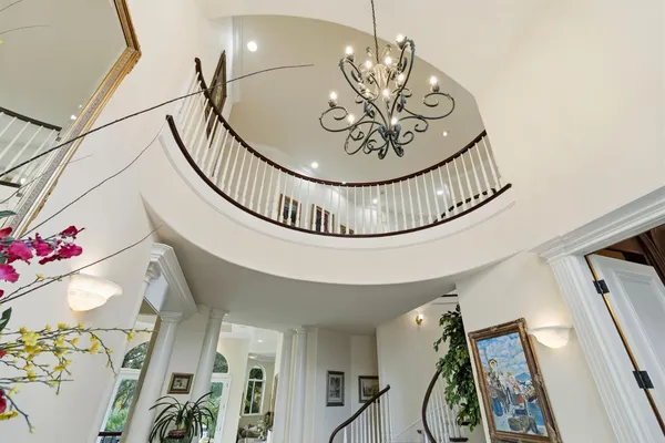 a livingroom with bookshelf and a large book shelf