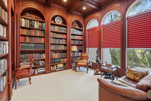 a view of a livingroom with furniture and hardwood floor