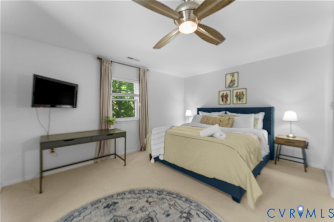 437 Plainview Road Kinsale, VA 22488 - Photo 45 of 63 a bedroom with a bed and a flat screen tv