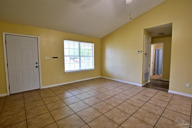 a view of an empty room and window