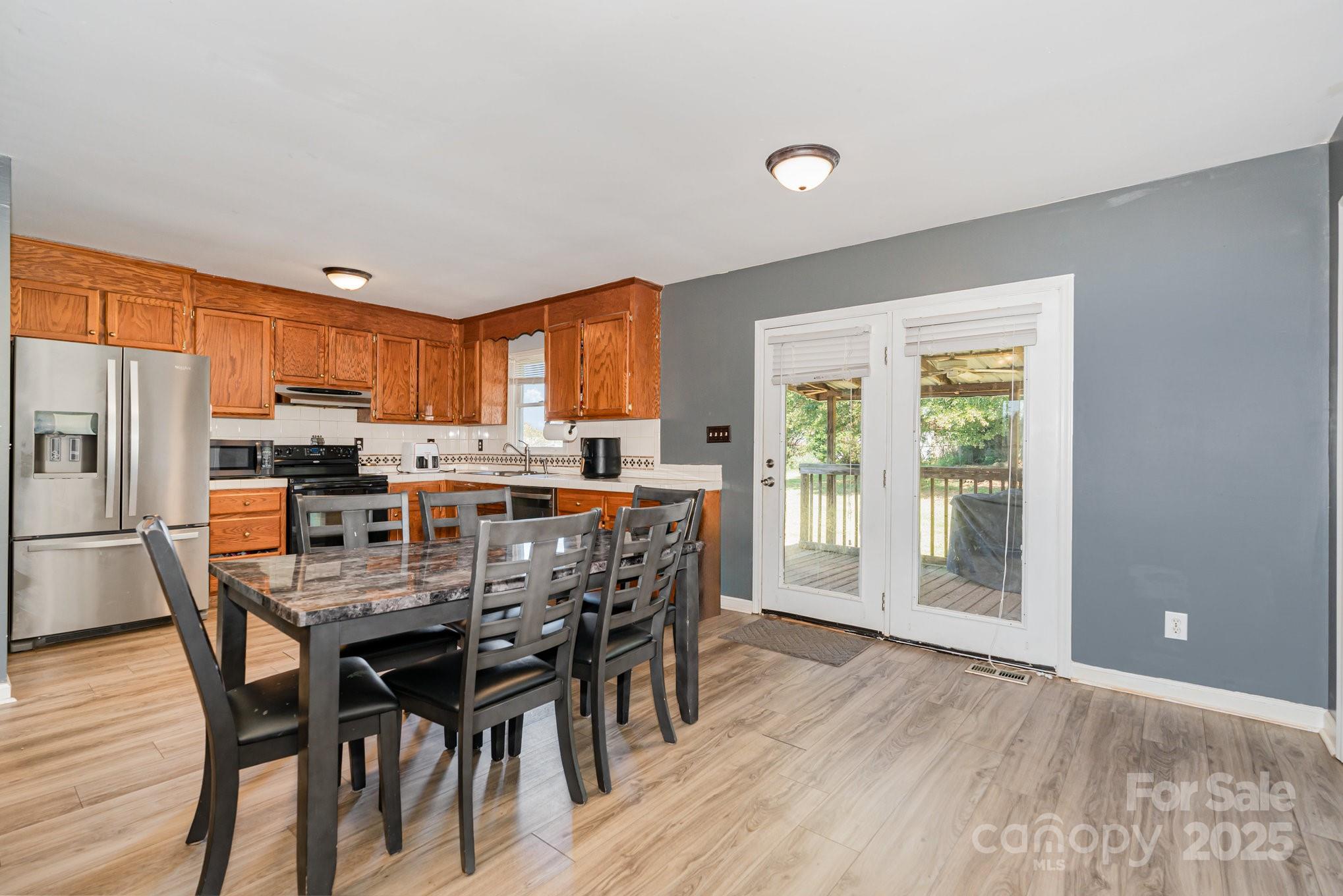 716 McDaniel Road Kings Mountain, NC 28086 - Photo 13 of 35 a view of a dining room with furniture and wooden floor