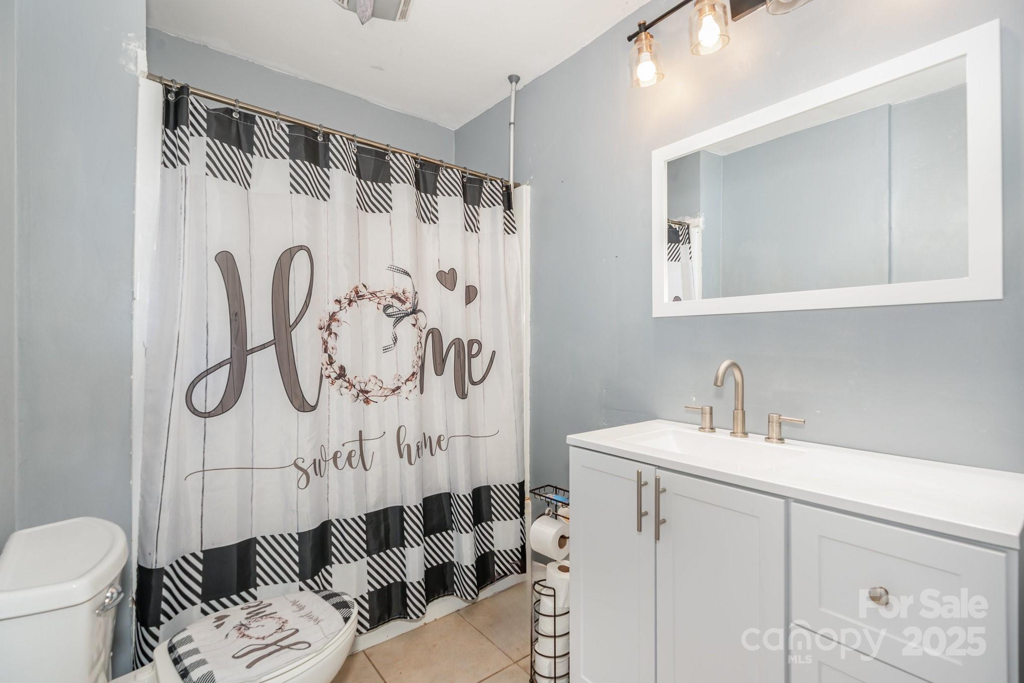 716 McDaniel Road Kings Mountain, NC 28086 - Photo 19 of 35 a bathroom with a sink and a mirror