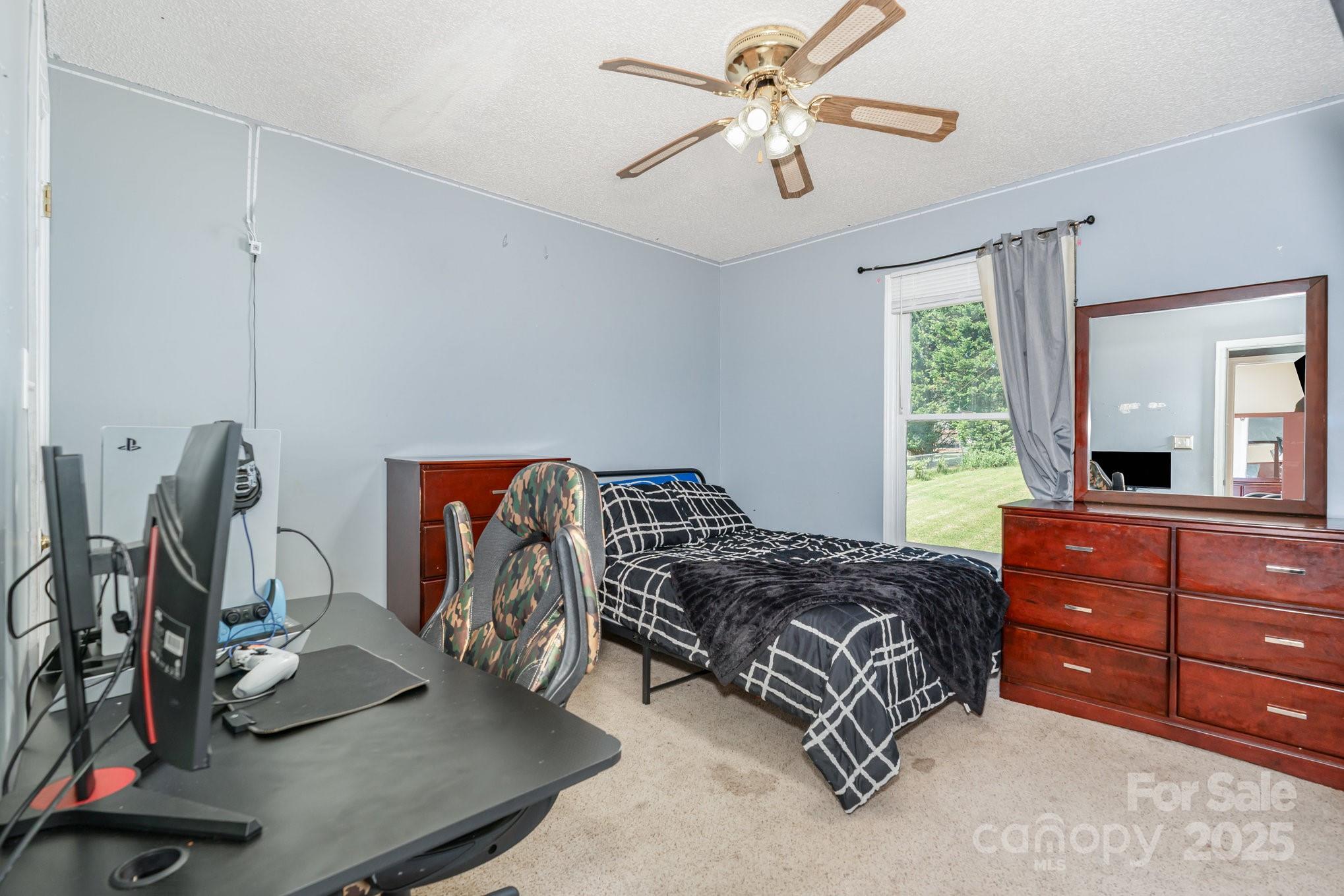 716 McDaniel Road Kings Mountain, NC 28086 - Photo 26 of 35 a bedroom with a bed and a mirror