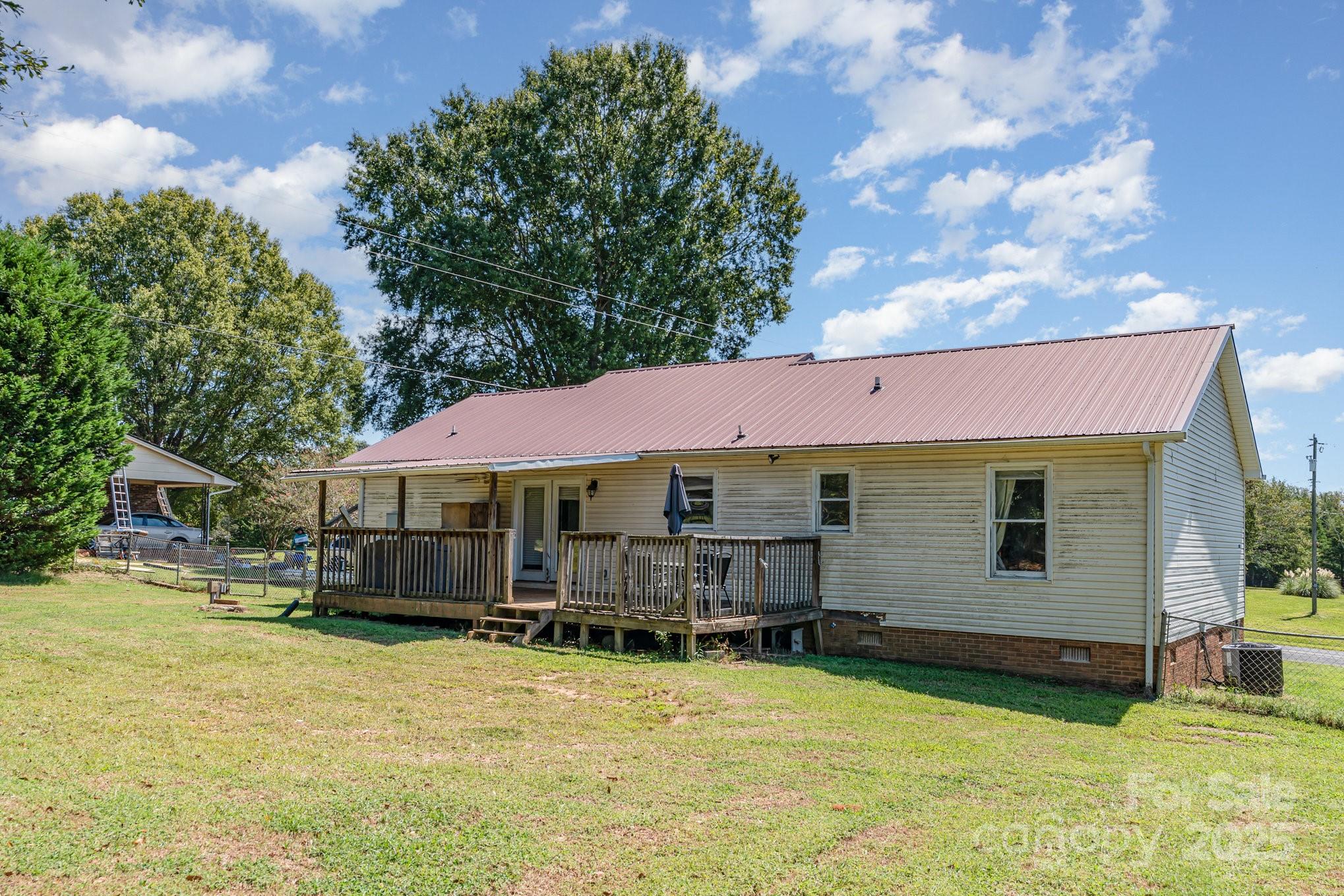 716 McDaniel Road Kings Mountain, NC 28086 - Photo 32 of 35 a view of a house with swimming pool and sitting area