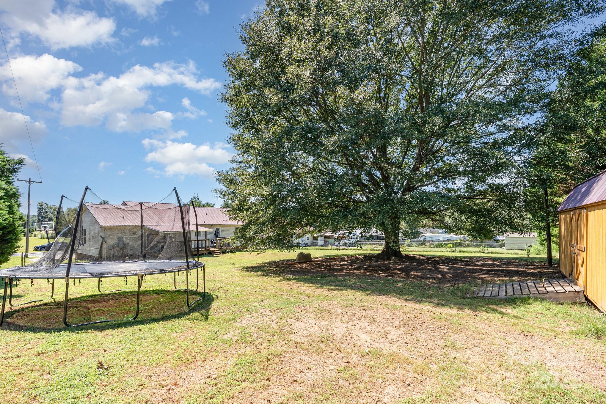 716 McDaniel Road Kings Mountain, NC 28086 - Photo 35 of 35 a view of a swimming pool with a yard