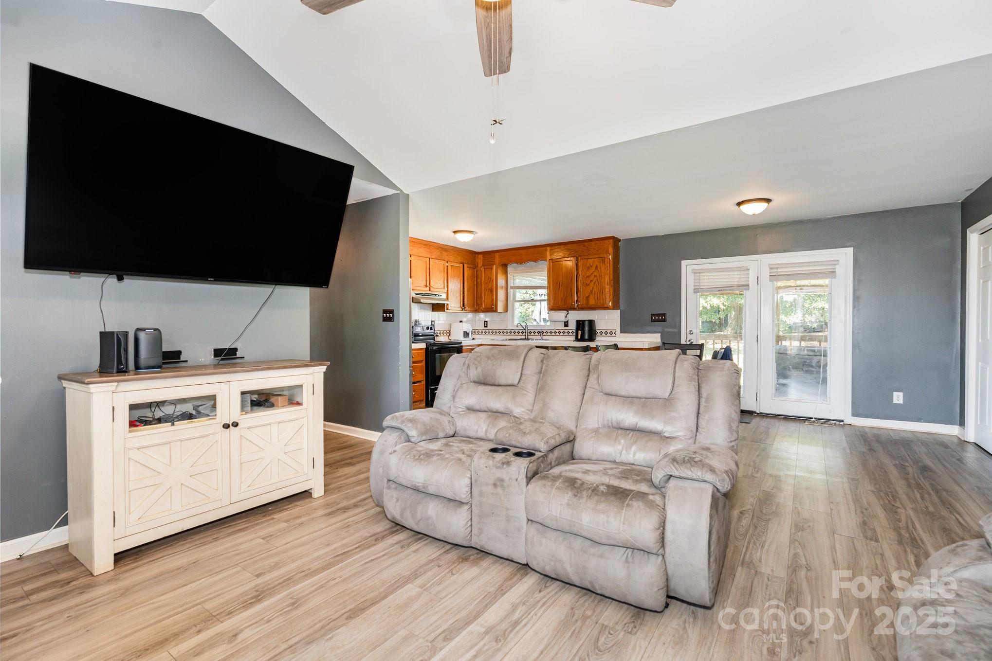 716 McDaniel Road Kings Mountain, NC 28086 - Photo 8 of 35 a living room with furniture and a flat screen tv