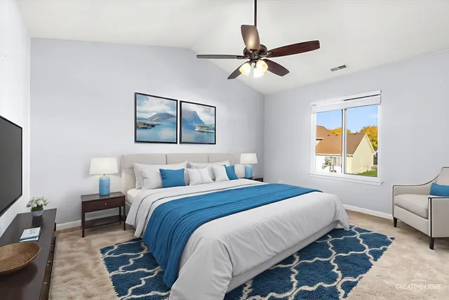 a bedroom with a bed and a couch