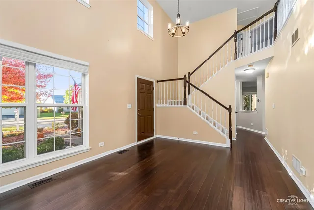 a view of an entryway with wooden floor