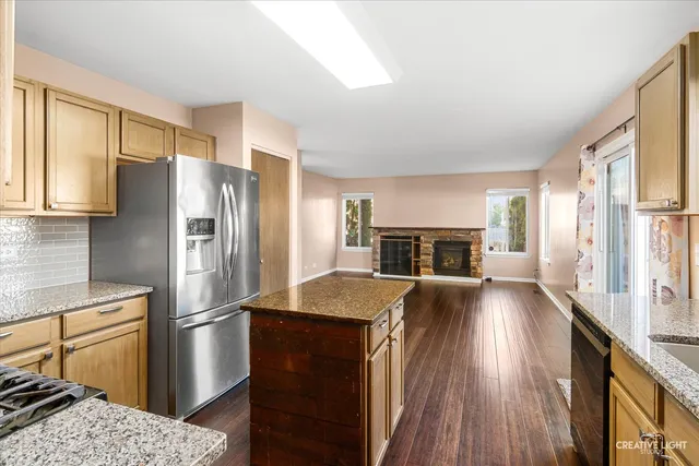 a kitchen with a refrigerator and a sink