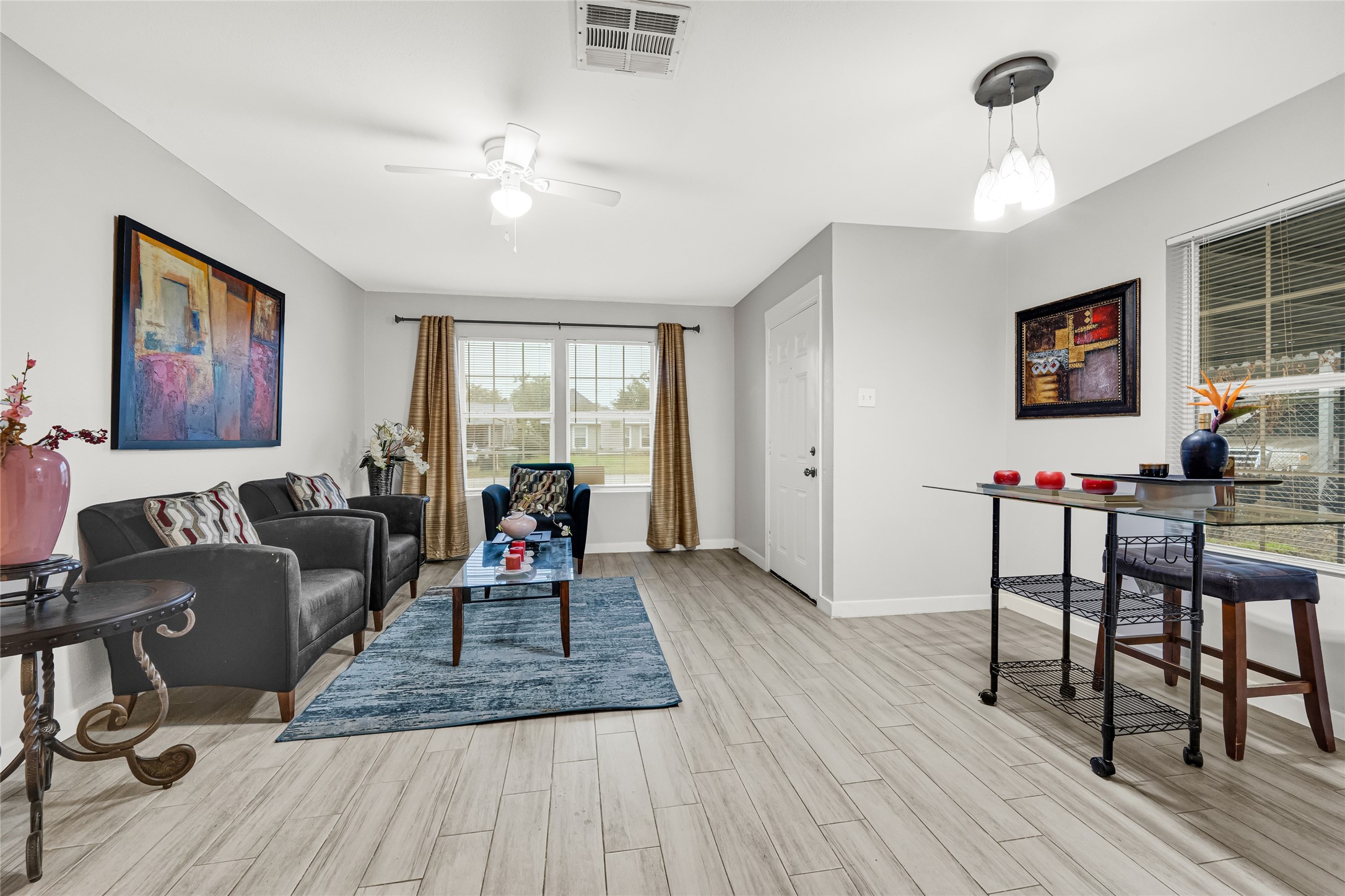 5009 Bataan Road Houston, TX 77033 - Photo 11 of 24 a living room with furniture and wooden floor