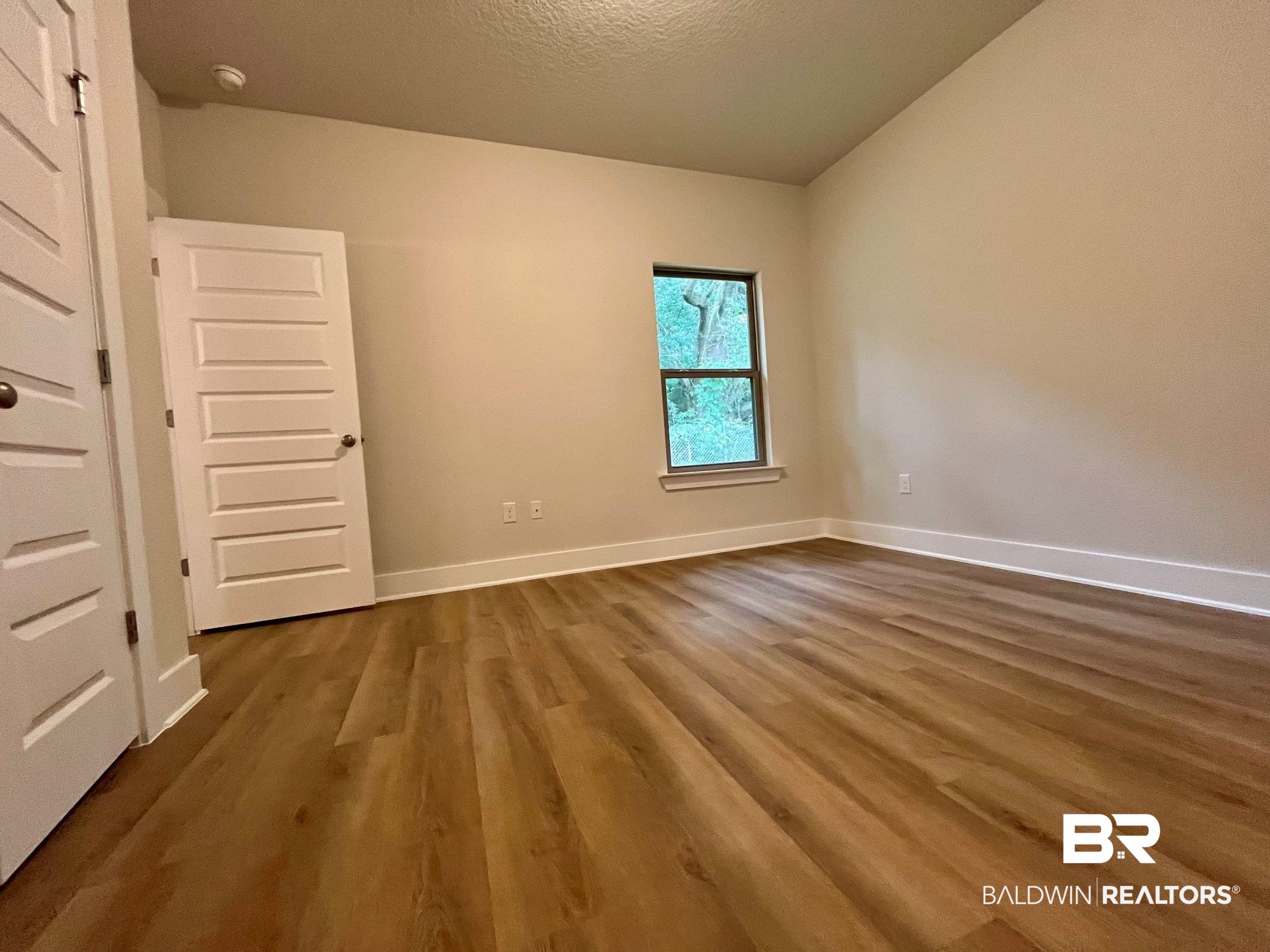 330 Barndling Street Fairhope, AL 36532 - Photo 20 of 31 Unfurnished room with a textured ceiling and hardwood / wood-style flooring