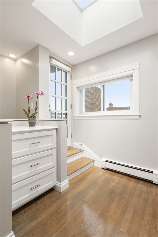 203 St Botolph Street, Unit 4 Boston, MA 02115 - Photo 11 of 14 a room with a dresser and a window