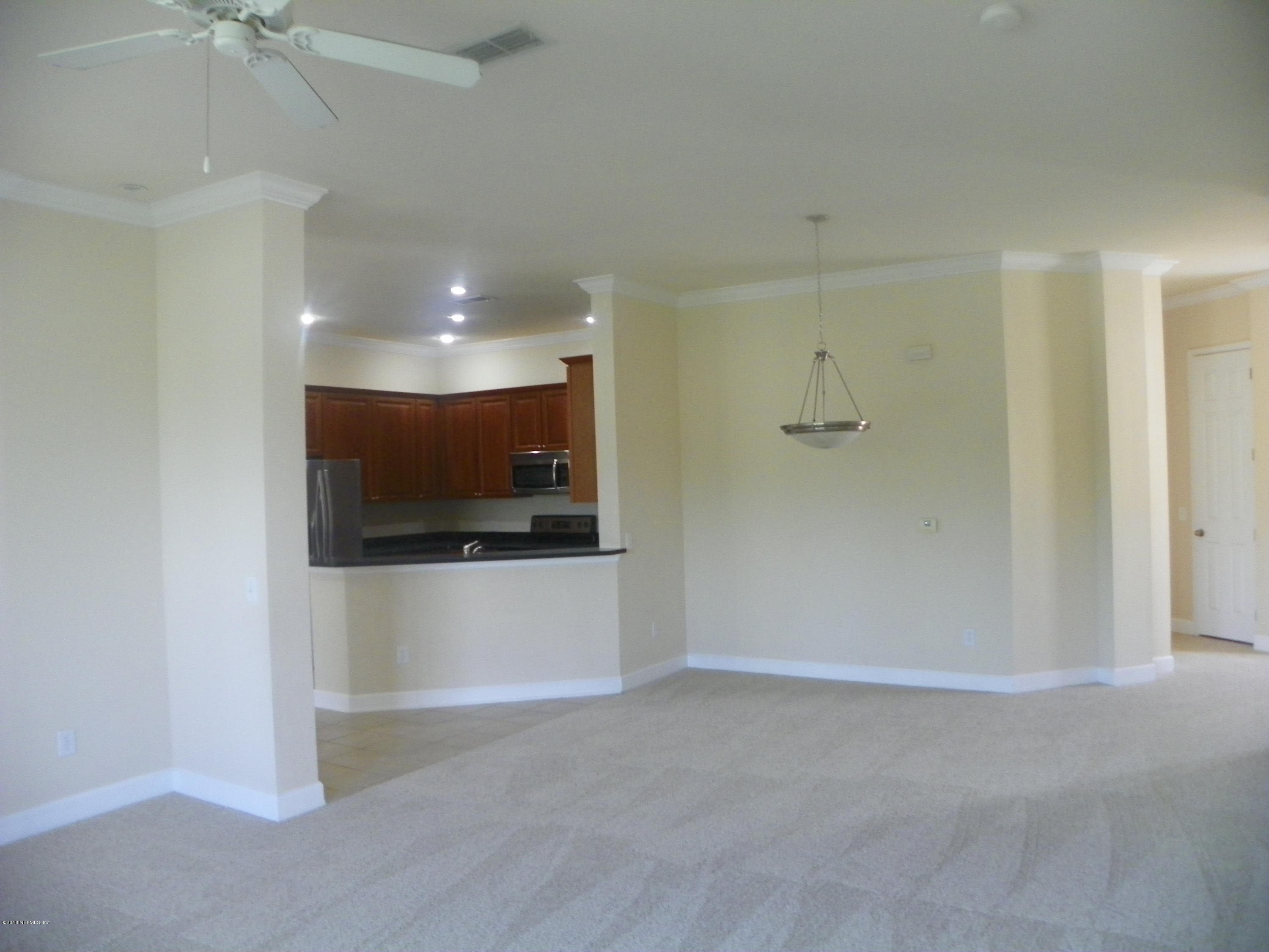 2017 Pond Ridge Court, Unit 1006 Fleming Island, FL 32003 - Photo 8 of 23 GRAT ROOM TO KITCHEN