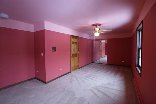23740 North High Ridge Drive Lake Zurich, IL 60047 - Photo 12 of 17 a view of an empty room with a ceiling fan